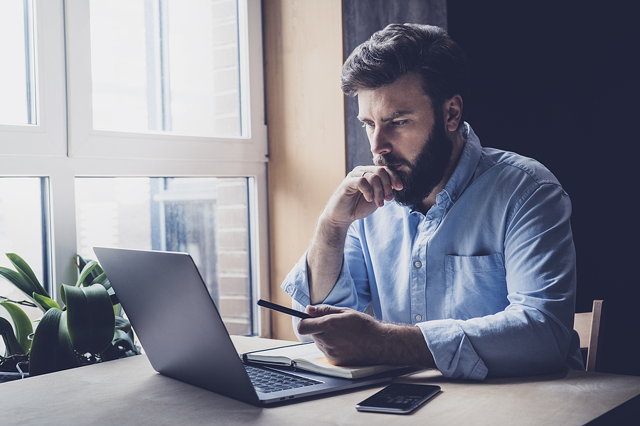 man checking his social media account